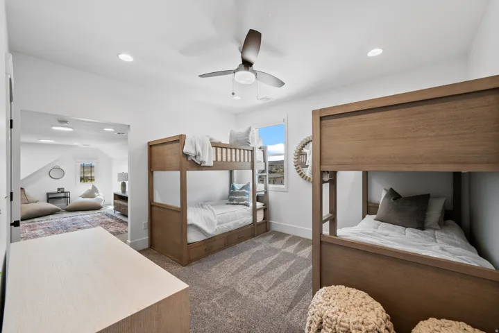 Room with recessed lighting, ceiling fan, and carpeted flooring