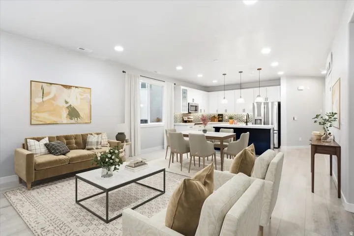 Open-concept living space with light-tone flooring