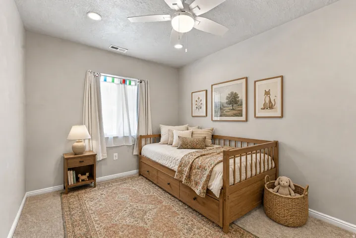 Recessed lighting, ceiling fan, and carpeted flooring