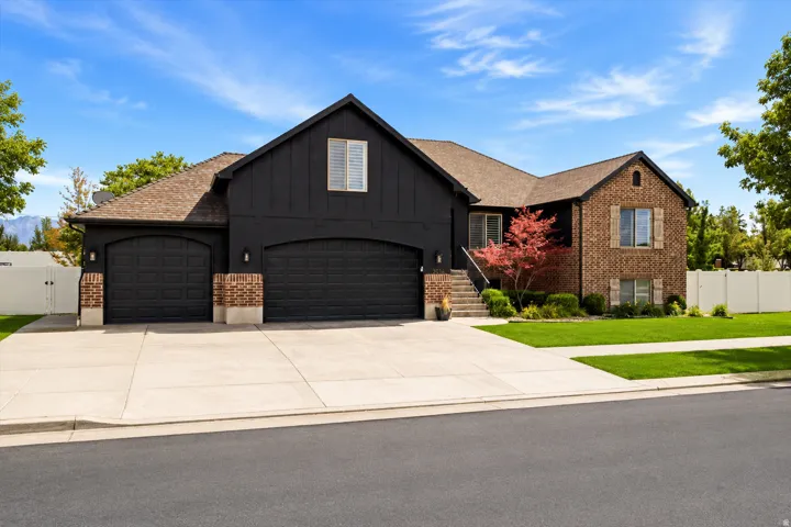 Brick and board-and-batten exterior with a shingle roof