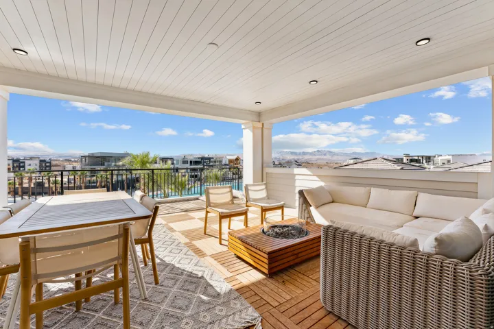 Covered patio with recessed lighting, wood-finish flooring, white paneled ceiling, and mountain backdrop