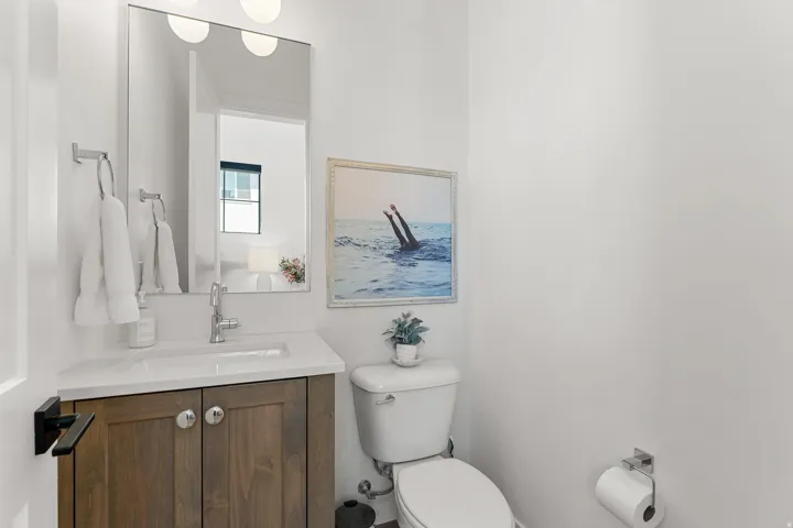 White-finish vanity with an integrated sink and chrome fixtures