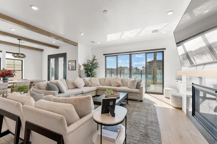 Recessed lighting, wood-finish flooring, and exposed ceiling beams