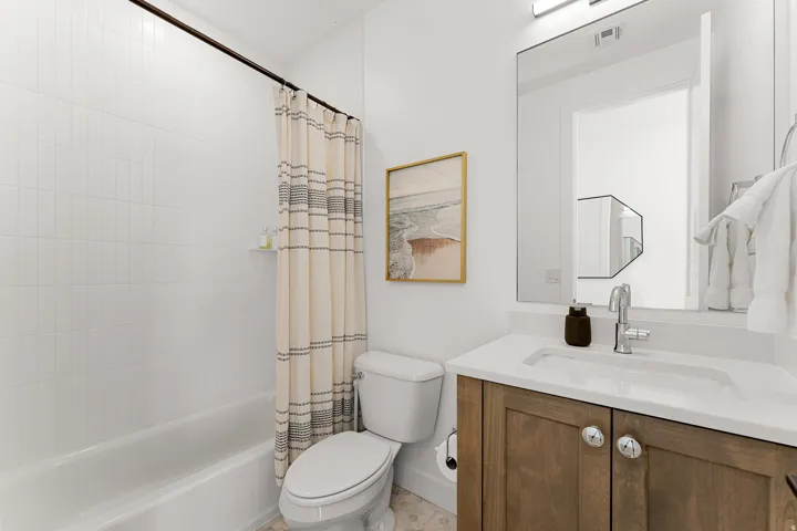 White subway tile shower surround with a built-in shelf