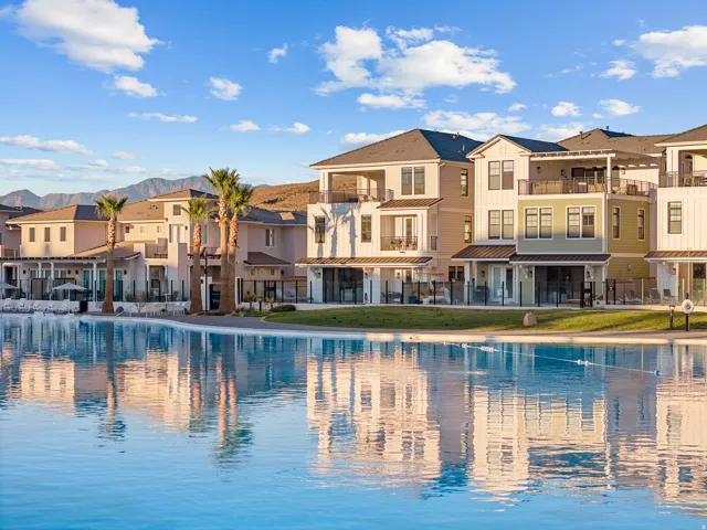 Multi-story residences with diverse architectural styles, featuring private balconies, individual patios, and a direct water frontage