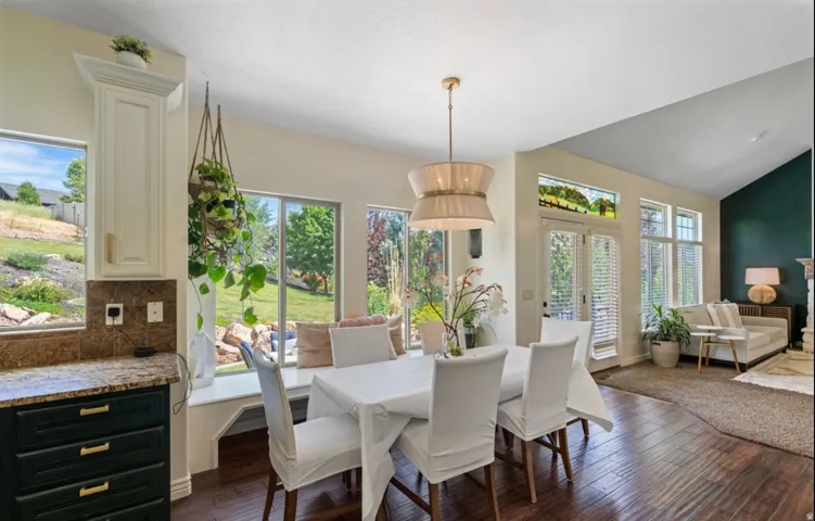 Wood-finish flooring, vaulted ceiling, and recessed lighting
