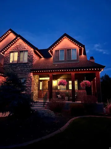 Stone and stucco exterior with dark trim accents