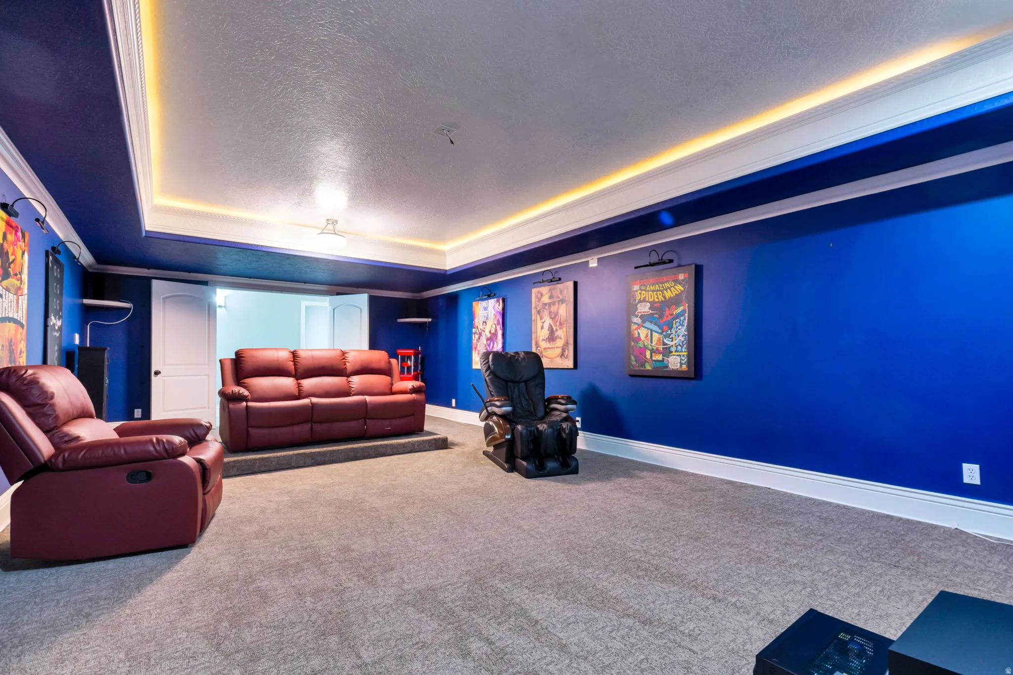 Tray ceiling with accent lighting, crown molding, wall-to-wall carpeting, and white trim