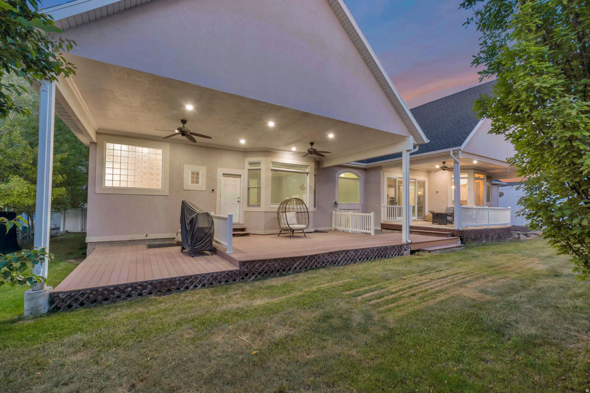 Expansive covered patio with recessed lighting and ceiling fans