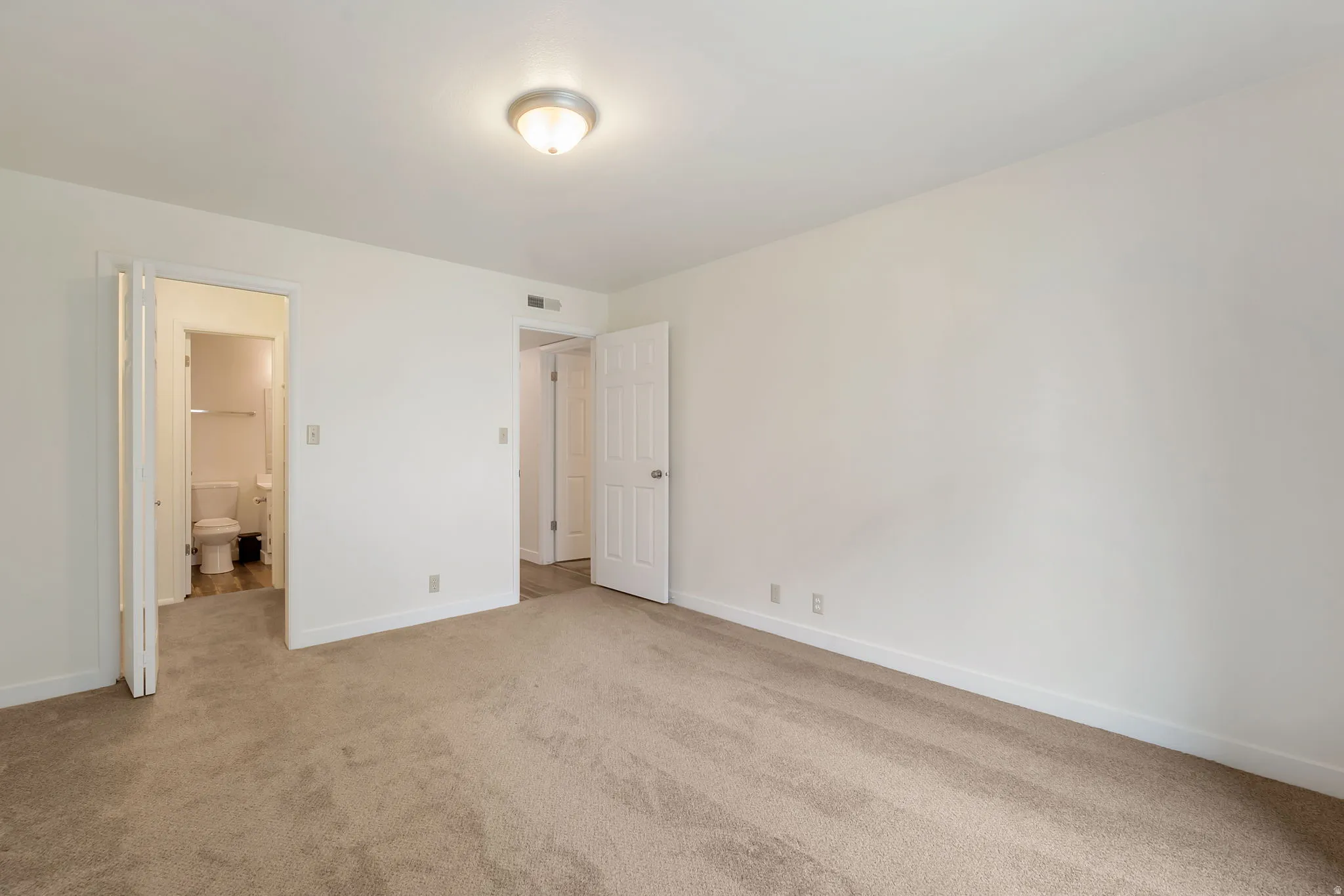 Bedroom 2 with attached bath and walk-in closet.