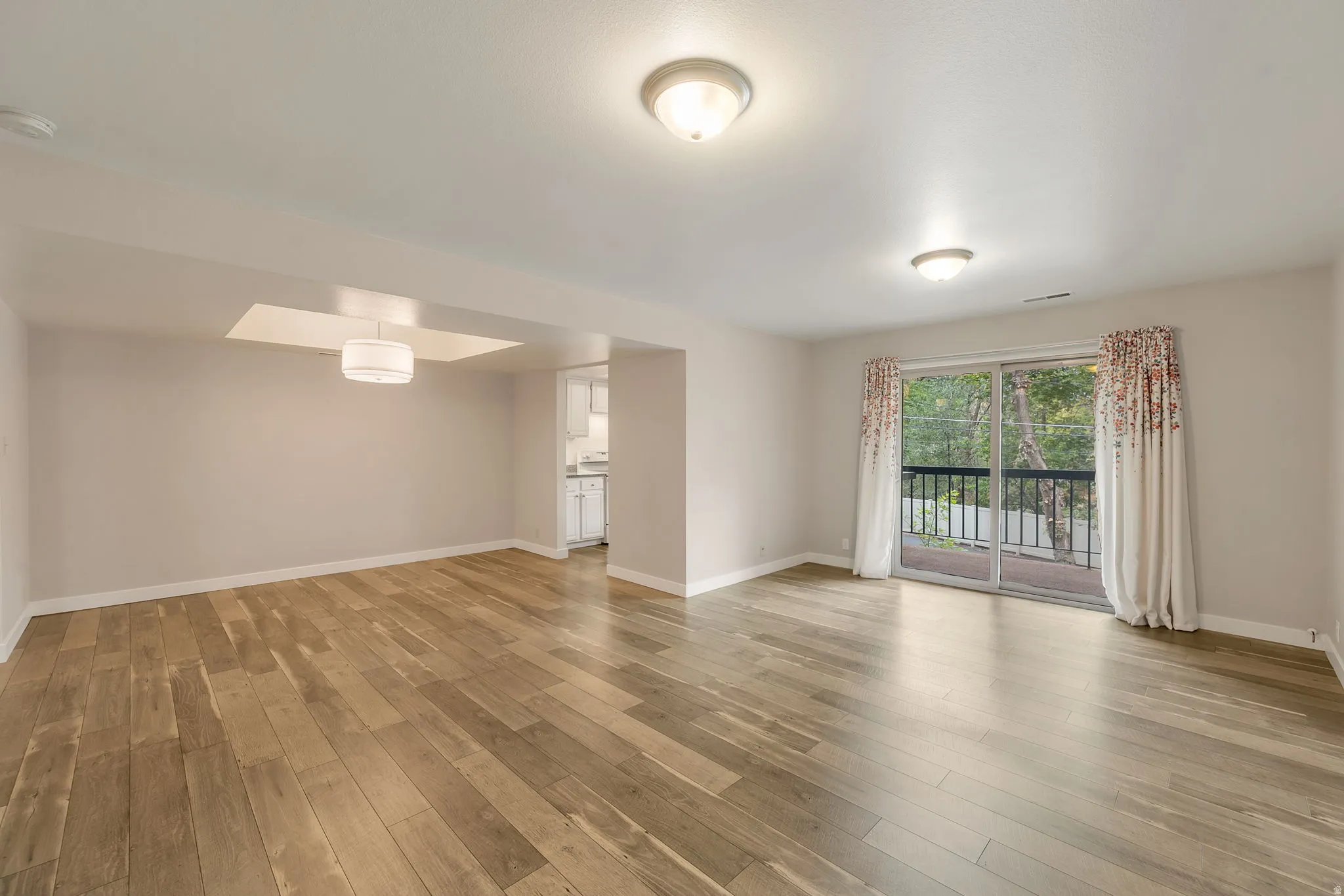 Laminate wood floors. Open floor plan.