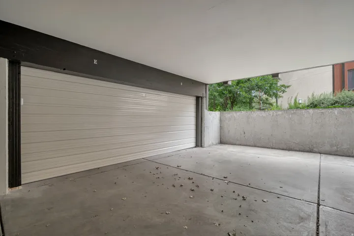 Newly installed garage door with opener and keypad. Storage closet.