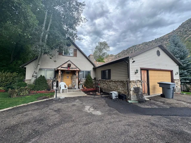 Multi-level exterior with stone accents and horizontal siding