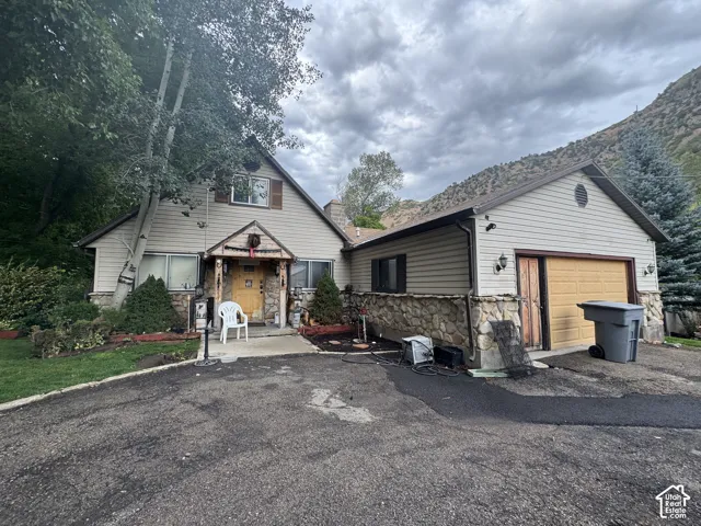 Multi-level exterior with stone accents and horizontal siding