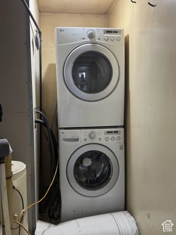 Stacked white front-load washer and dryer unit