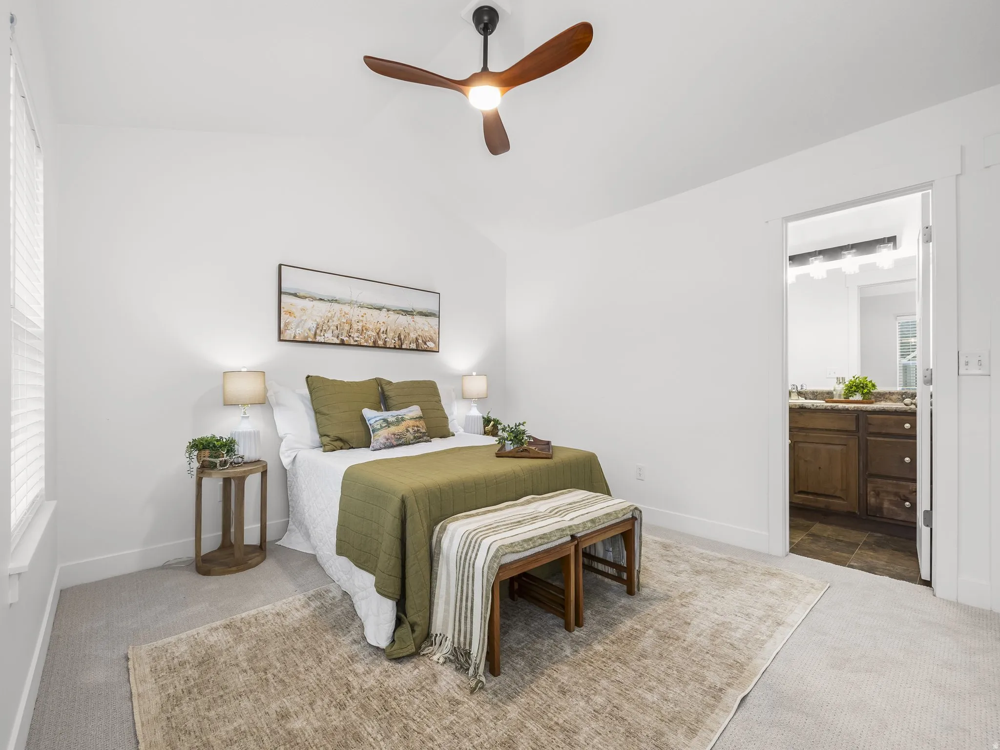 Vaulted ceilings with a ceiling fan, carpet flooring, and a window with blinds