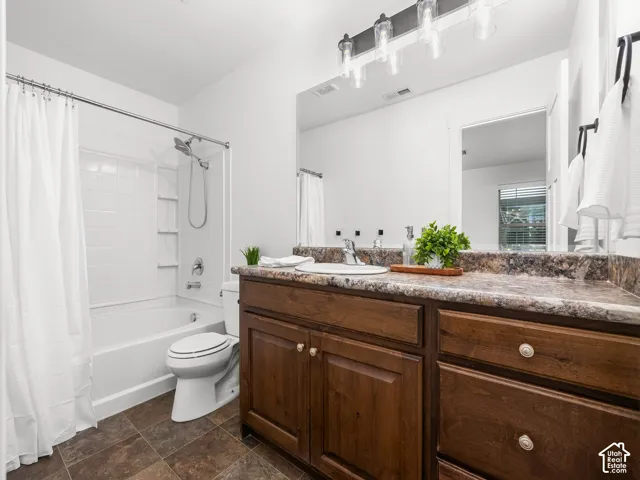 White bathtub and shower combination with white subway tile surround