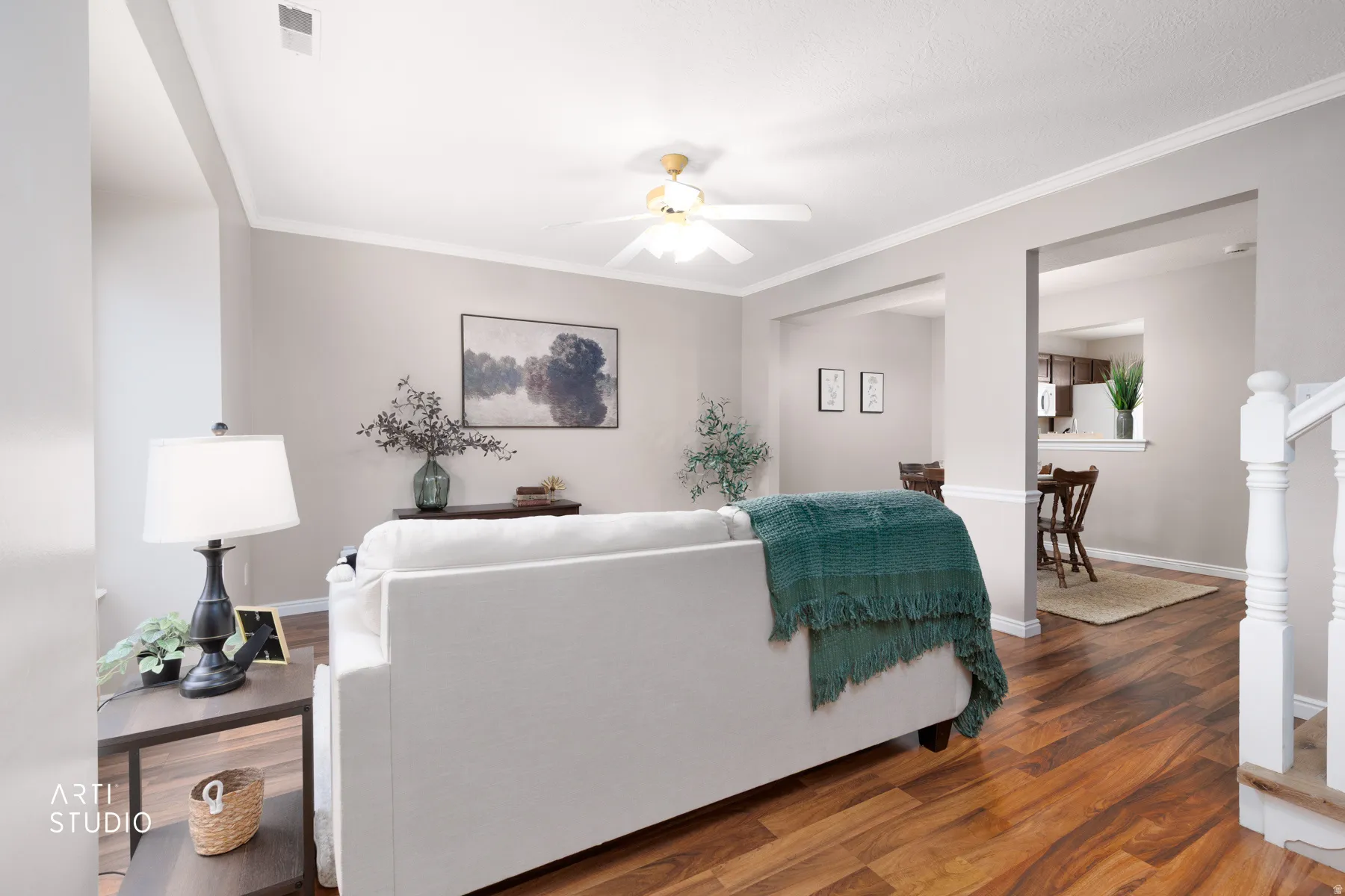 Vinyl flooring, crown molding, white trim, and a ceiling fan with light fixture