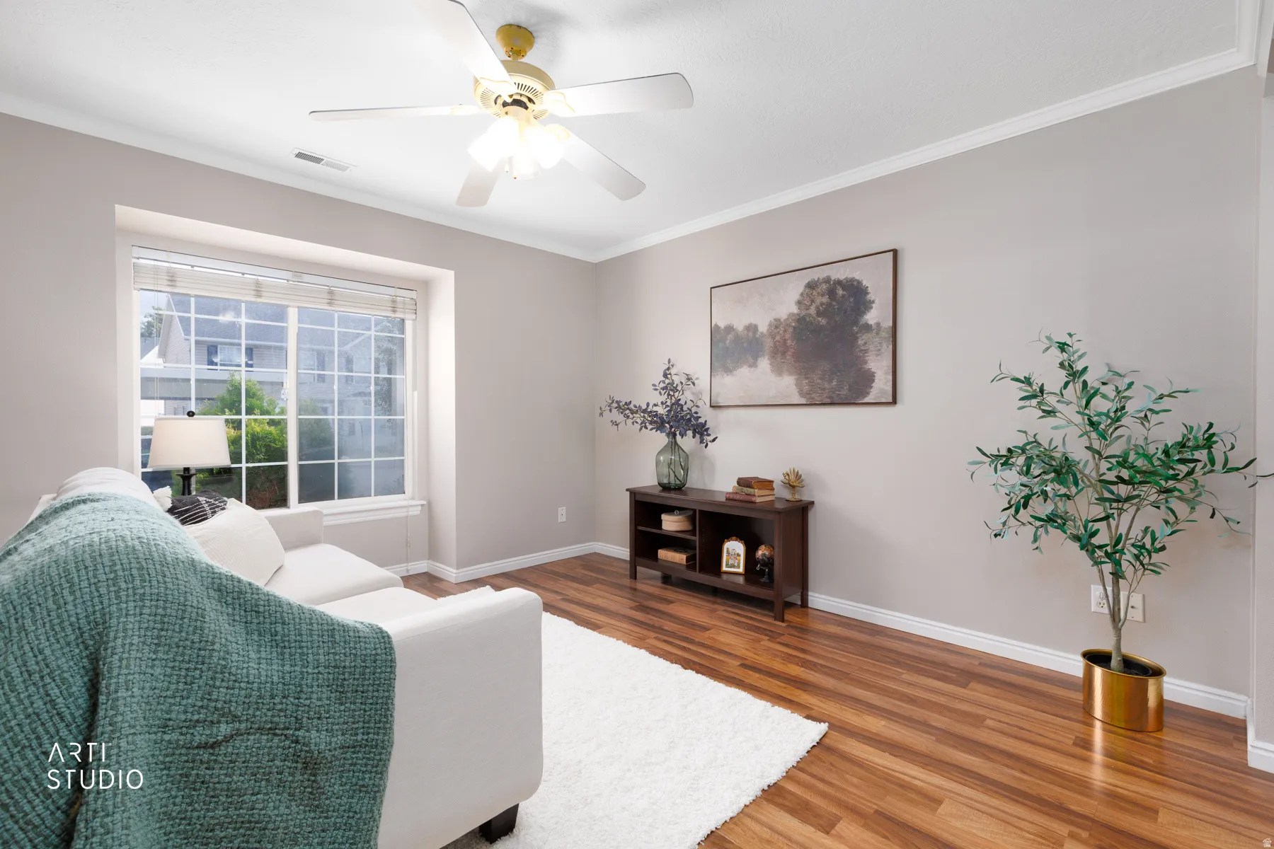 Vinyl flooring with crisp white baseboards and crown molding