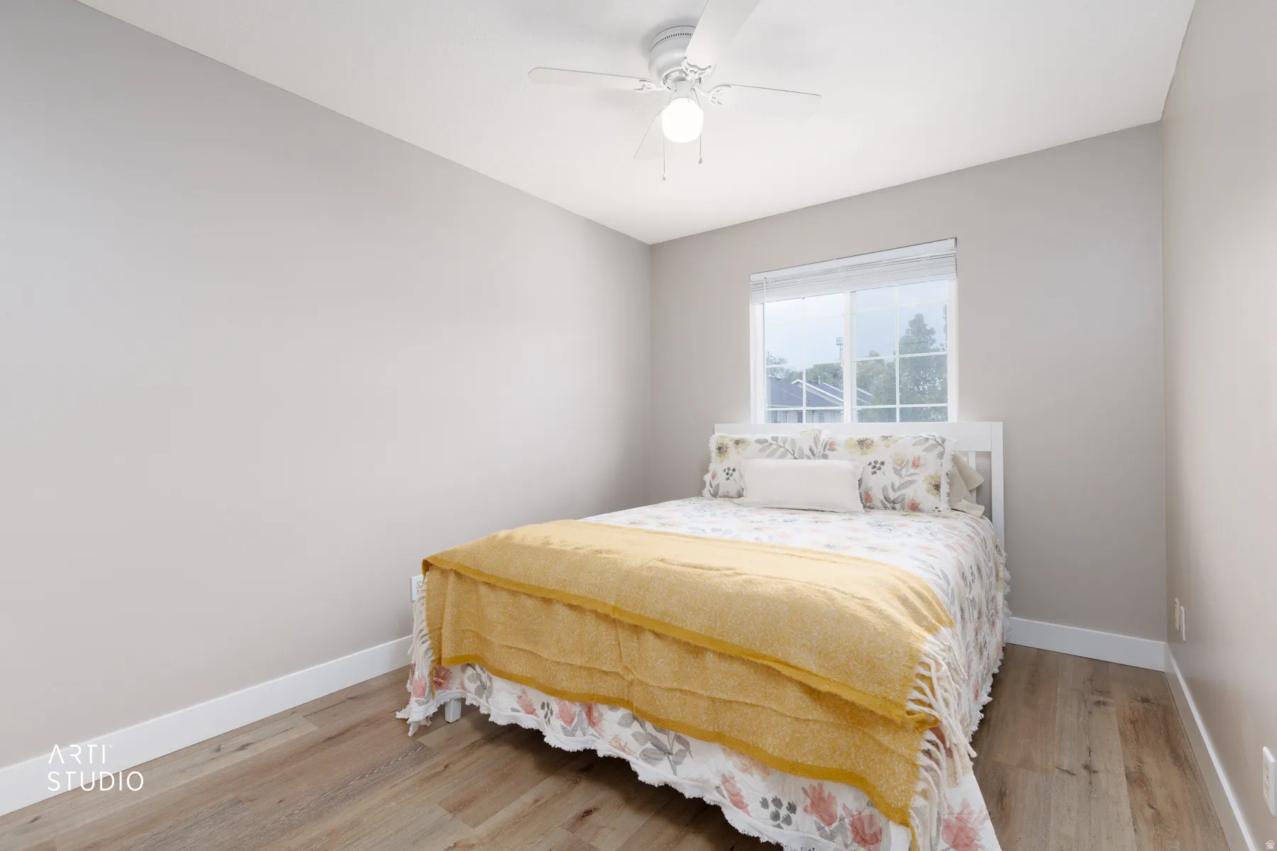 LVP flooring, white trim, single window, and ceiling fan with integrated lighting