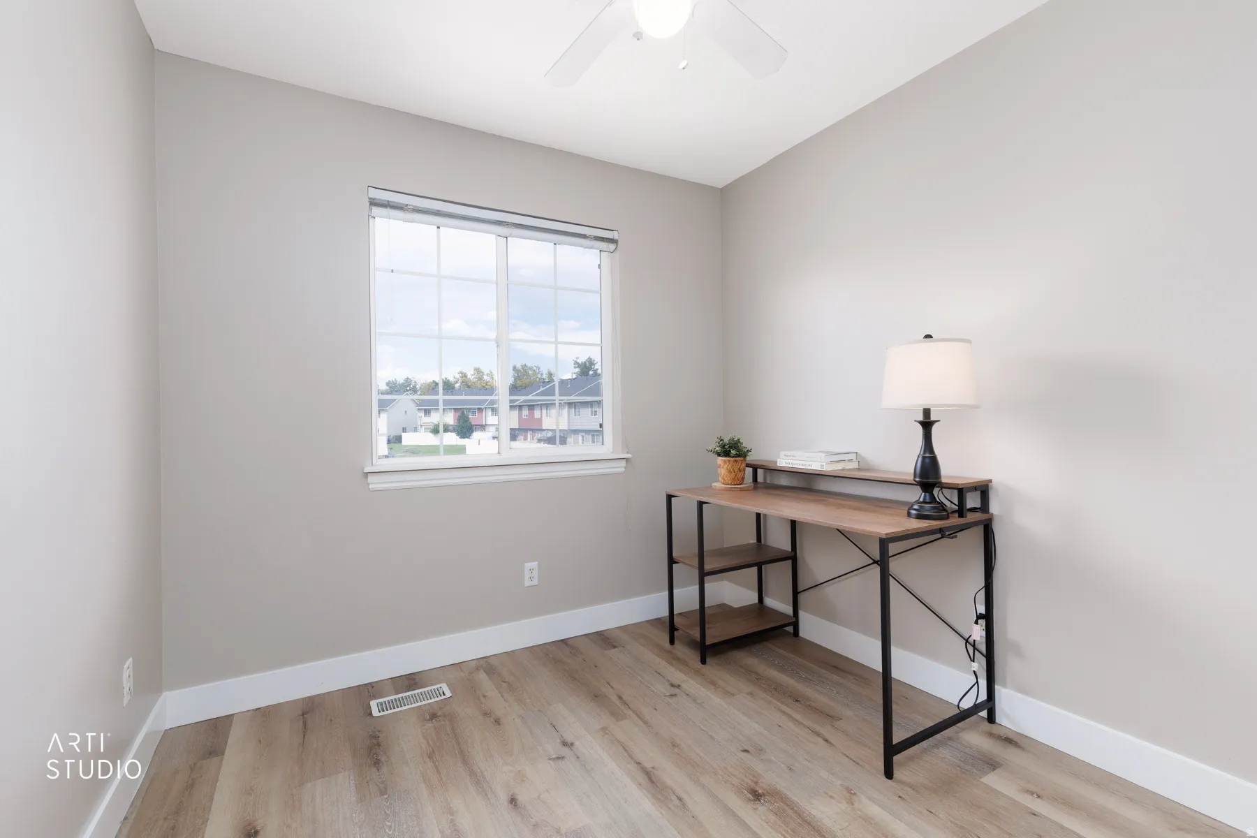 LVP flooring, white window trim, and a ceiling fan with integrated lighting