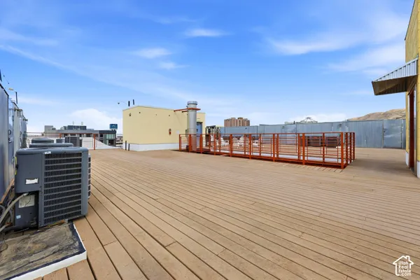 Expansive rooftop deck featuring composite planking and metal railings