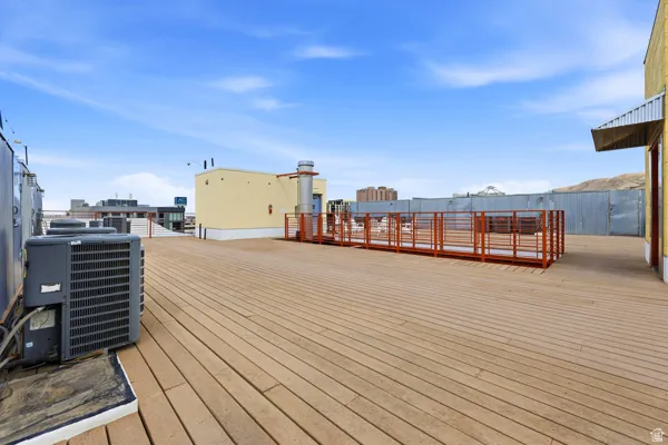 Expansive rooftop deck featuring composite planking and metal railings