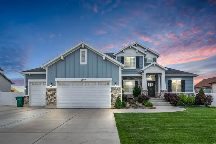Two-story exterior with multi-toned siding and stone accents