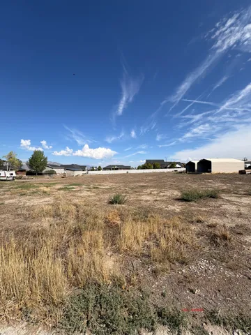Expansive lot featuring undeveloped land and a clear sky overhead