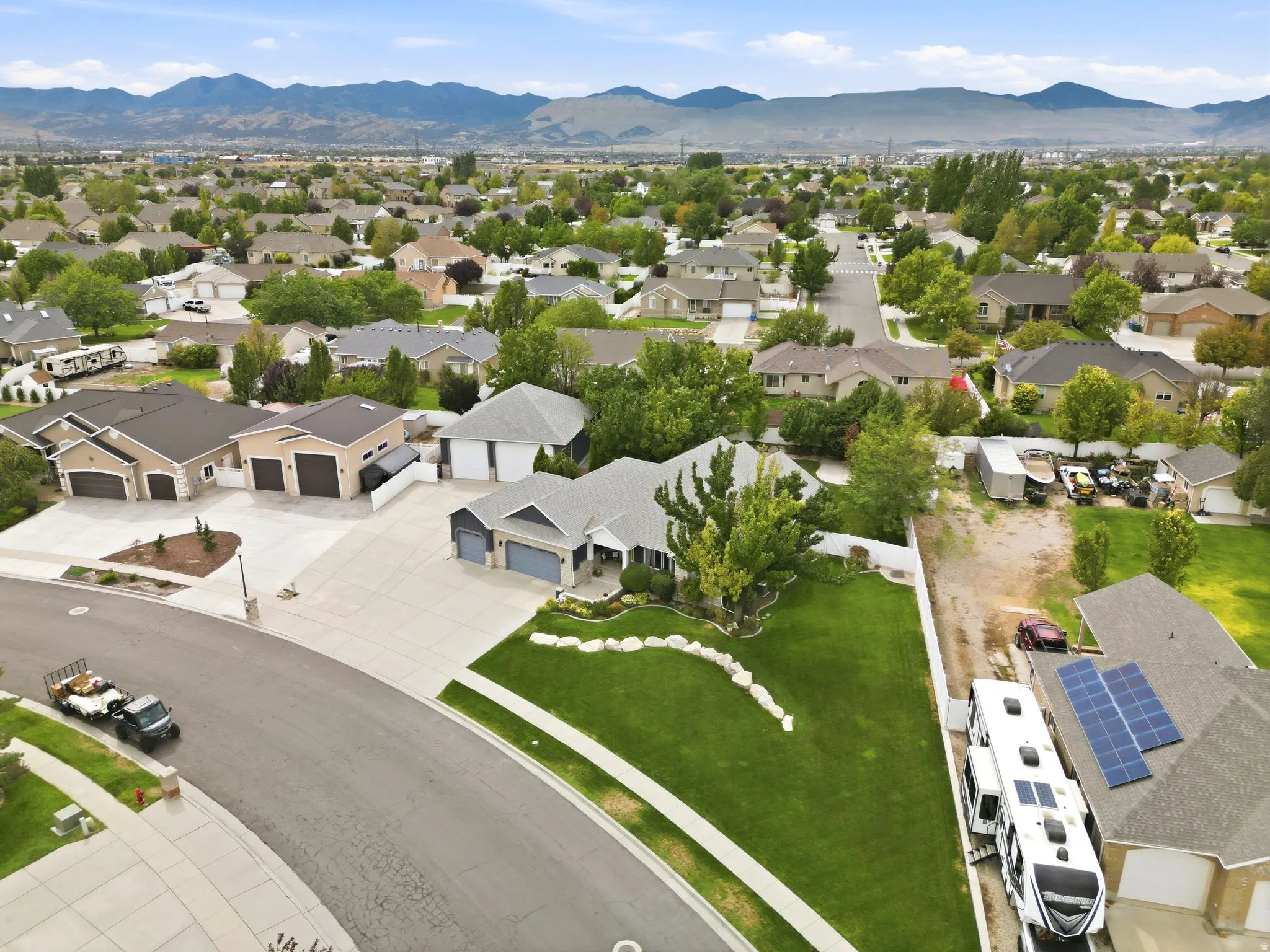 Well-maintained residential neighborhood with distant mountain ranges