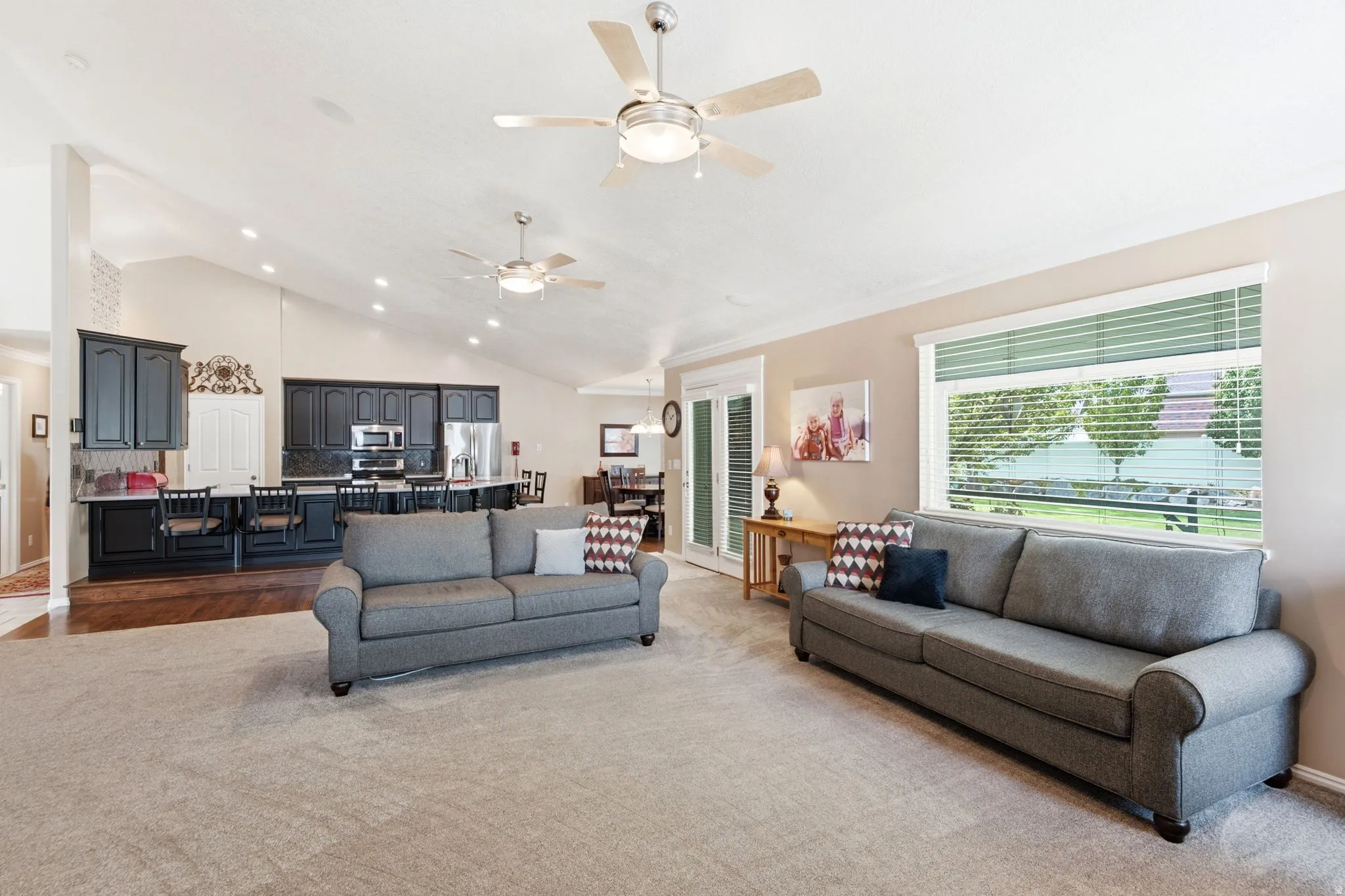 Vaulted ceilings with recessed lighting and ceiling fans