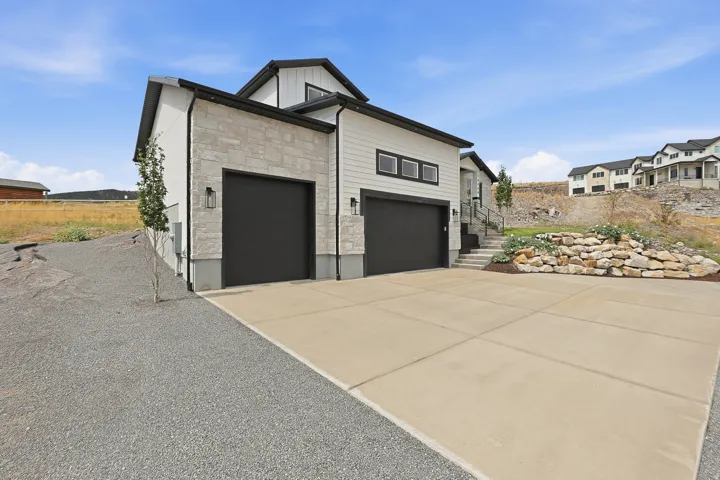 Modern exterior with light-colored stone accents and horizontal siding