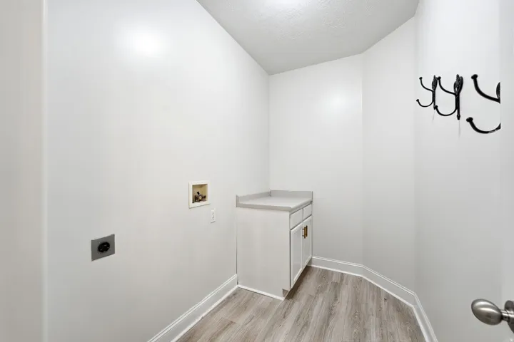 Main-level laundry with a folding counter. You will find this to be very spacious and convenient