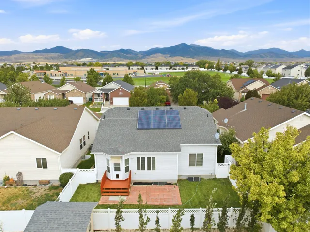 Rear exterior featuring a bay window, deck, and patio. Not to mention Solar panels that the Seller has paid in full. You get to enjoy the benefit without the debt