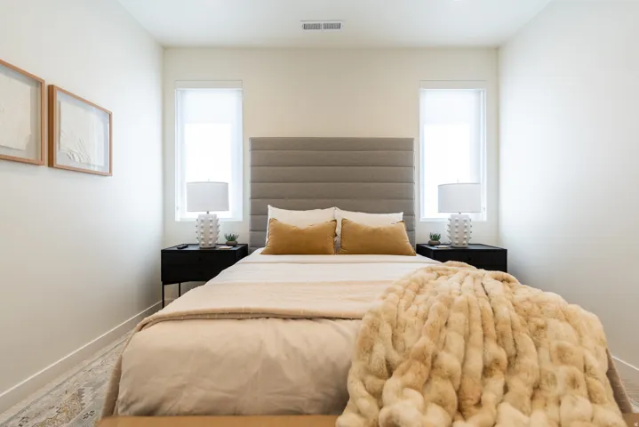 Recessed lighting illuminates neutral walls and wood-finish flooring