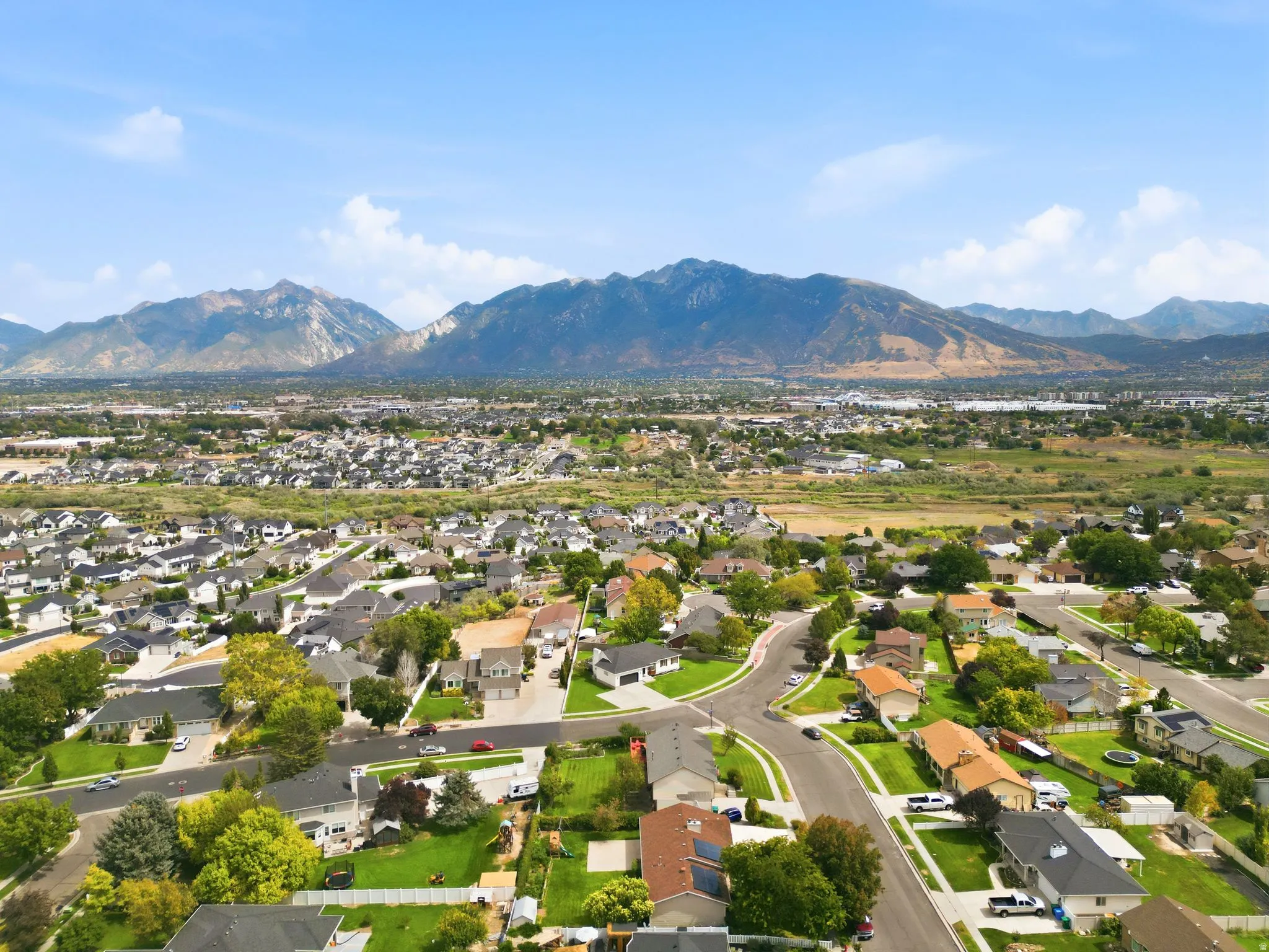 Expansive residential area featuring established homes, paved streets, and varied landscaping
