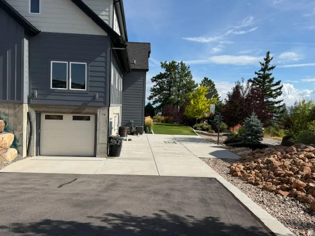 Multi-level exterior with dark gray siding and light gray accents