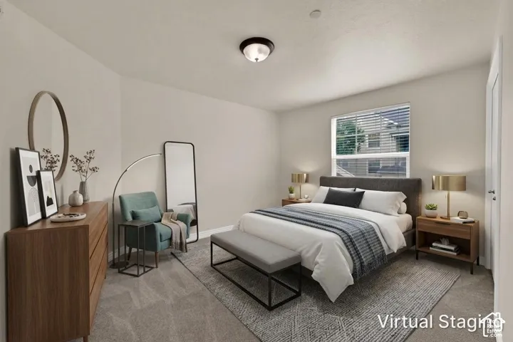 Bedroom 2 with new carpet, window with blinds, and flush mount lighting (virtual staging)