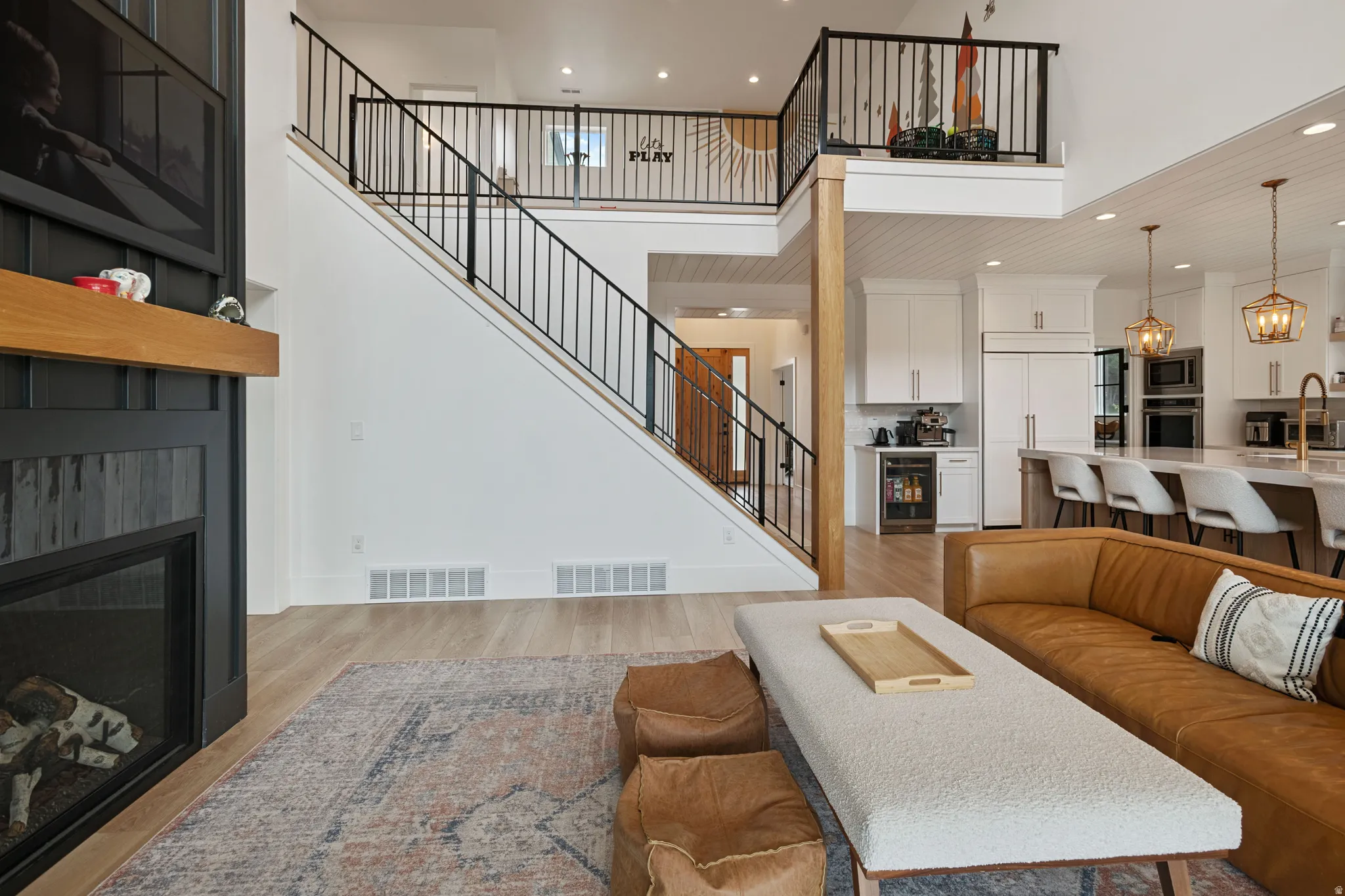 Open-concept living space with wood-finish flooring