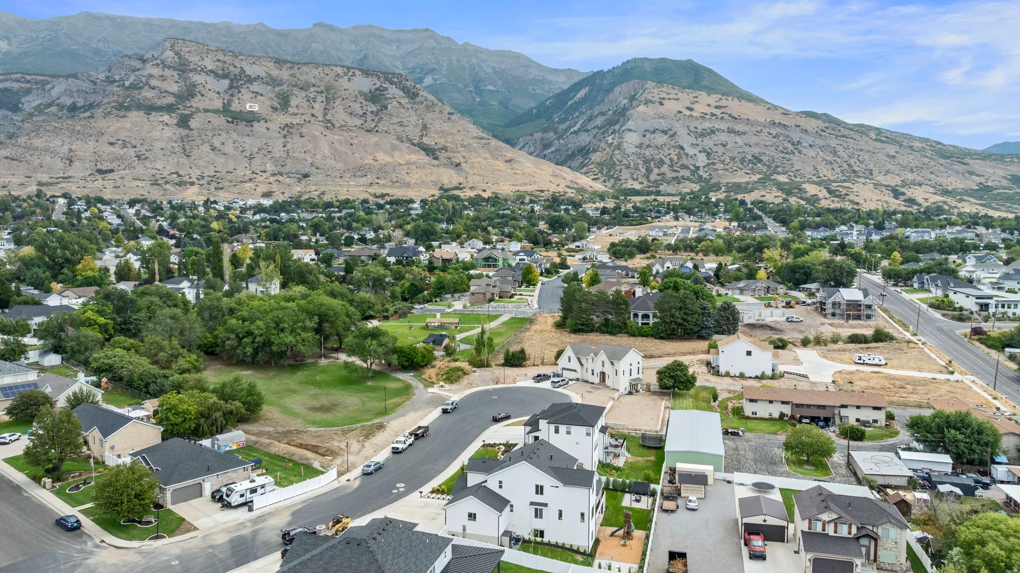 Mountain backdrop with established residential areas and new construction