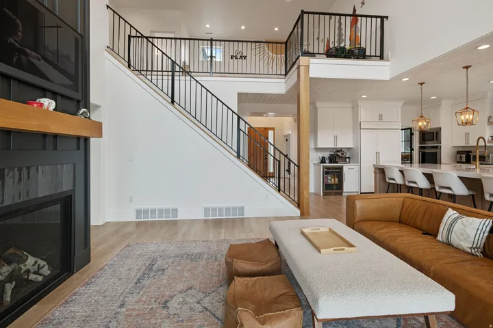 Open-concept living space with wood-finish flooring