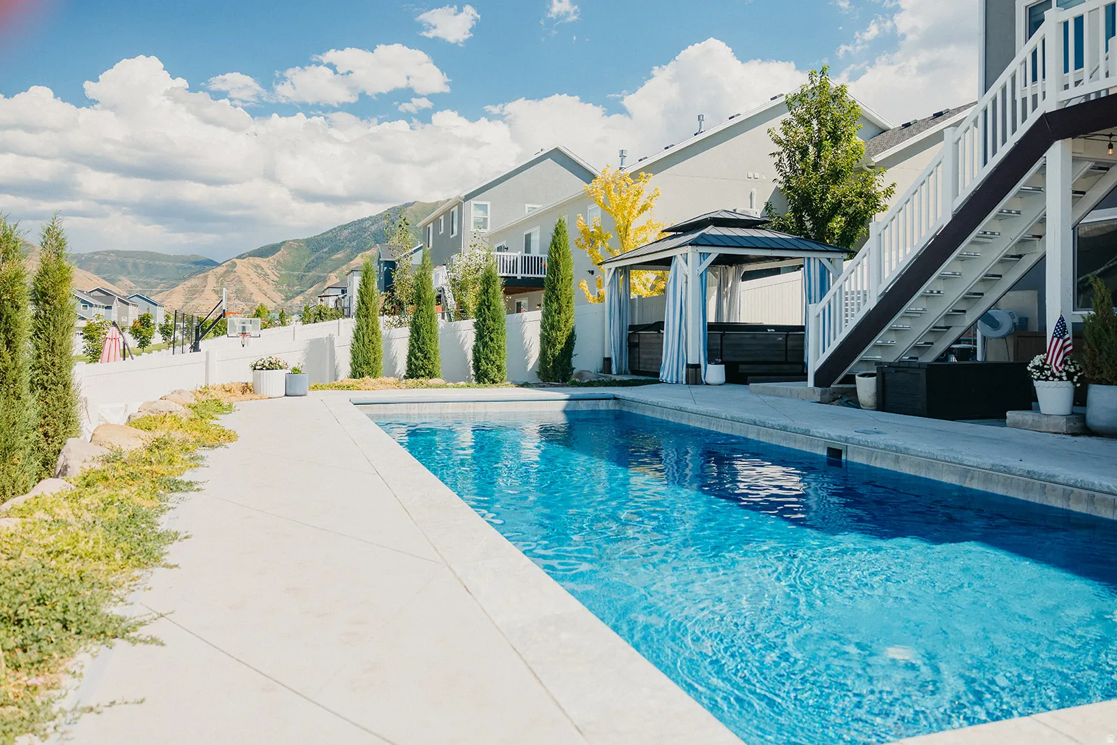 Rectangular in-ground swimming pool with concrete surround