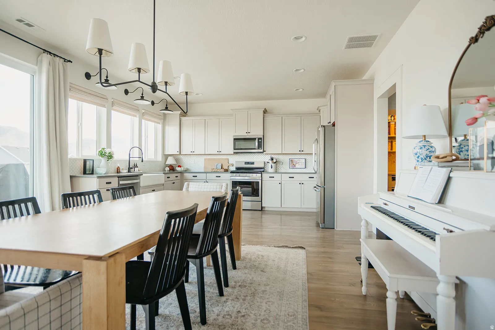 Kitchen with light-toned cabinetry and stainless steel appliances