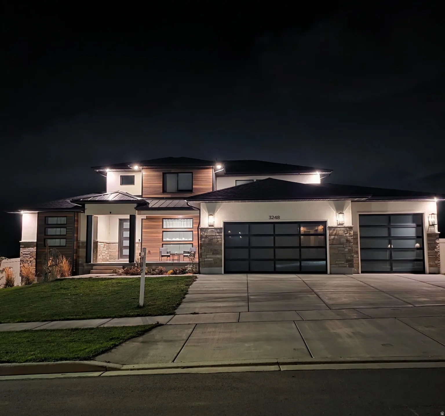 Contemporary exterior featuring wood-look siding and stone accents