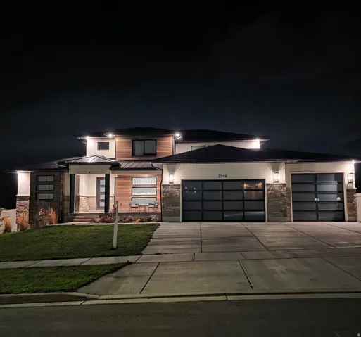 Contemporary exterior featuring wood-look siding and stone accents