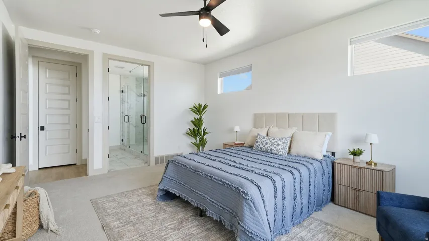 Carpeted room featuring a ceiling fan, recessed lighting, and high windows