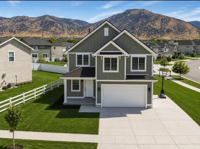 Contemporary-style residence with neutral greige siding and white trim