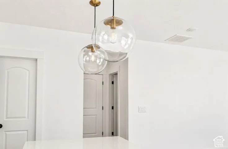 Modern pendant lighting with clear glass globes and brass accents
