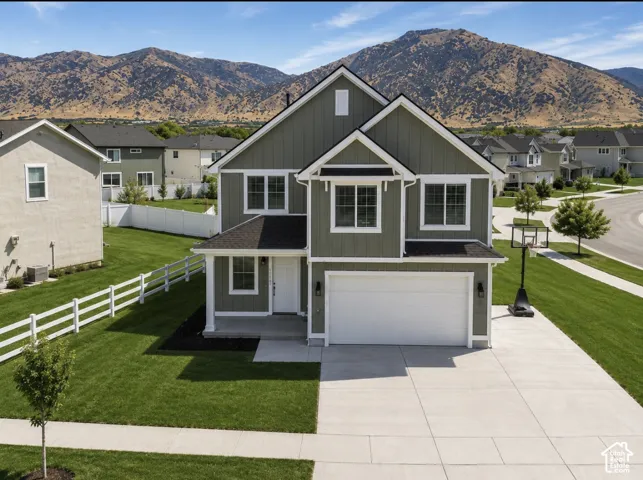 Contemporary-style residence with neutral greige siding and white trim