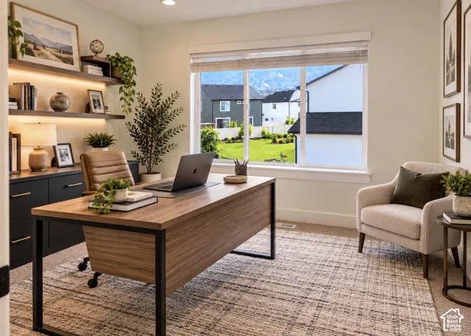 Bedroom 4 / Office: Built-in dark cabinetry with recessed under-shelf lighting and floating wood-finish shelving, large picture window with horizontal blinds, and wall-to-wall carpeting